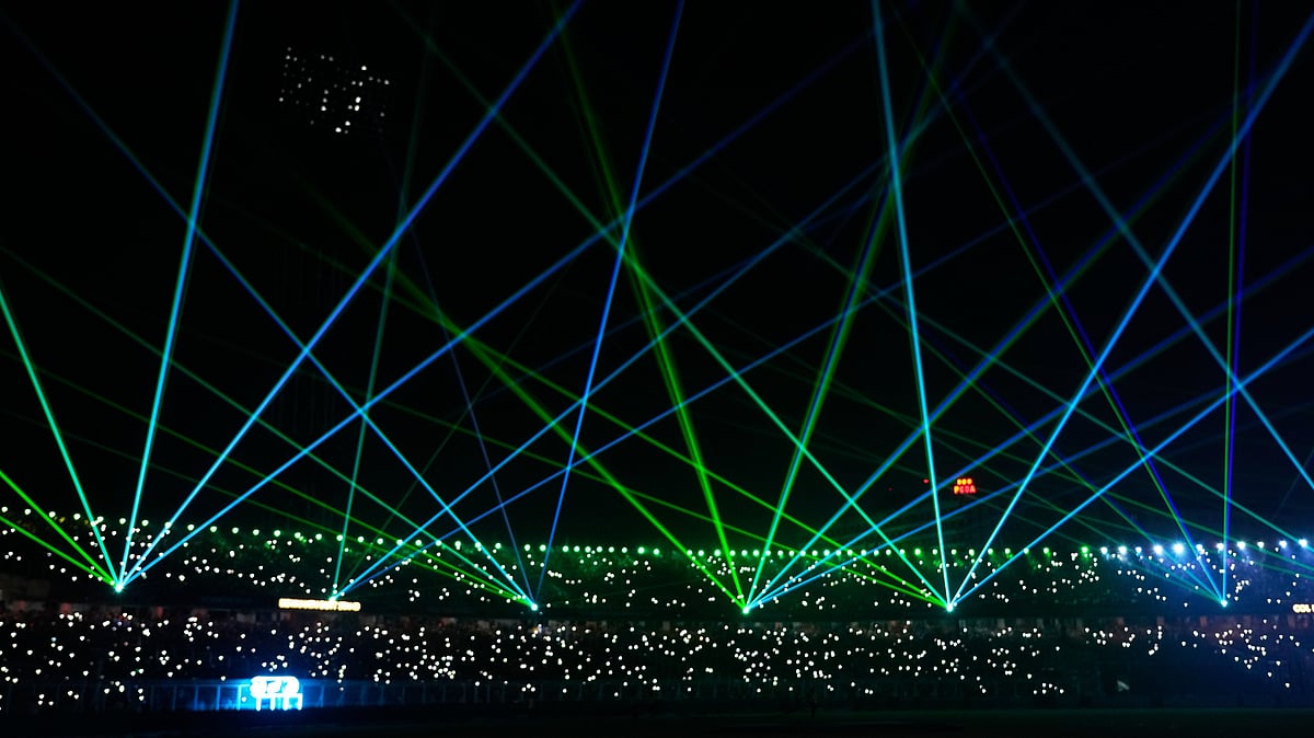 (AP Photo/Bikas Das) : A laser show entertains the spectators during a drinks break of the T20 World Cup cricket match between India and West Indies in Kolkata, India, Sunday, March 1, 2026
