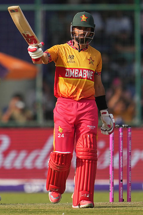 Zimbabwe's captain Sikandar Raza celebrates his fifty runs during the T20 World Cup cricket match between South Africa and Zimbabwe in New Delhi.