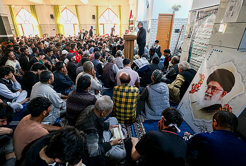 People offer prayers following the alleged killing of Iran's Supreme Leader Ayatollah Ali Khamenei in a US-Israel strike, at a mosque, in Jammu. Iran confirmed Khamenei's death after airstrikes targeted his compound in Tehran. 