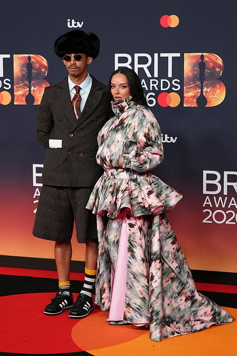 Jordan Stephens and Jade Thirlwall pose for photographers upon arrival at the Brit Awards 2026 in Manchester, England.