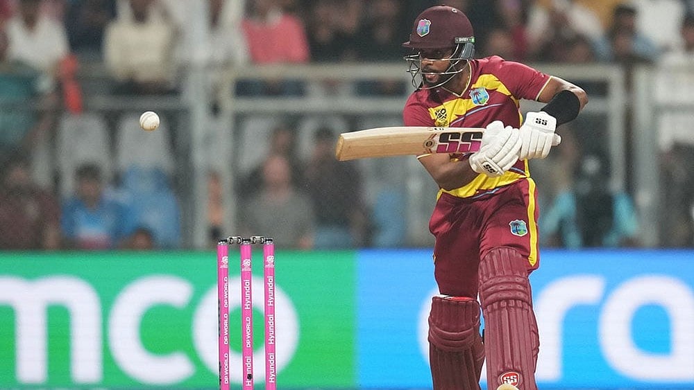 | Photo: AP/Rafiq Maqbool : West Indies' Brandon King plays a shot during the T20 World Cup cricket match between England and West Indies in Mumbai, India.