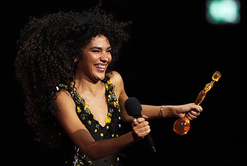 Olivia Dean wins the Pop Act award during the Brit Awards 2026 in Manchester, England.