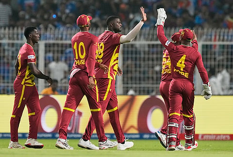 West Indies' Jason Holder, third left, celebrates with teammates the wicket of India's Ishan Kishan during the T20 World Cup cricket match between India and West Indies in Kolkata.