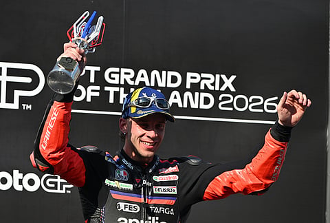 MotoGP winner Italy's rider Marco Bezzecchi celebrates on the podium after the MotoGP at the Chang International Circuit in Buriram, Thailand.