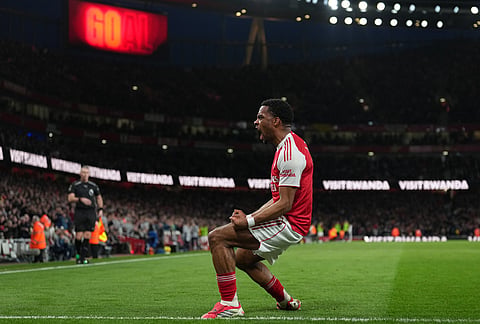Arsenal's Jurrien Timber celebrates after scoring during the Premier League soccer match between Chelsea Arsenal in London.