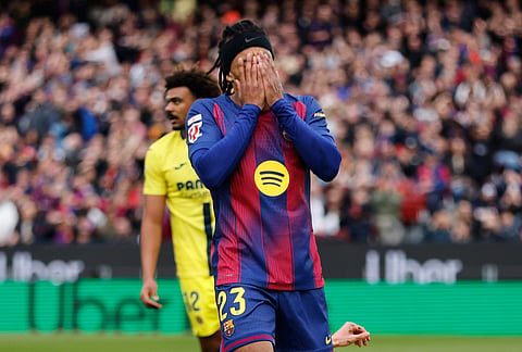 Barcelona's Jules Kounde reacts during the Spanish La Liga soccer match between Barcelona and Villareal in Barcelona, Spain.