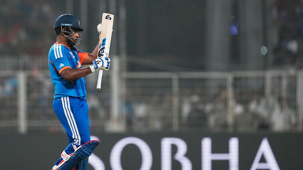  (AP Photo/Bikas Das) : India's Sanju Samson applauds a shot by batting partner Tilak Varma during the T20 World Cup cricket match between India and West Indies in Kolkata, India, Sunday, March 1, 2026.