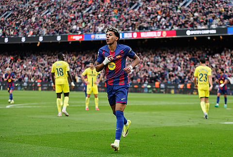 Barcelona's Lamine Yamal celebrates scoring his side's 2nd goal during the Spanish La Liga soccer match between Barcelona and Villareal in Barcelona, Spain.