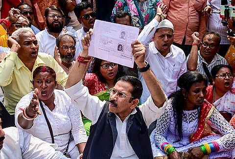 West Bengal Congress President Subhankar Sarkar with party supporters, stages a protest in front of the Chief Electoral Officer's office against the alleged discrepancies in the SIR, in Kolkata.