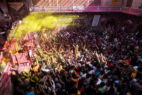 Vrindavan: People smeared in 'gulal' during celebrations ahead of the 'Holi' festival, at 'Shri Radhavallabh Lal Ji Temple' in Vrindavan, Uttar Pradesh.