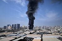 The Second Phase Of The US-Iran War Explained: Why The Conflict Is Escalating Again Altaf Qadri; AP : A black plume of smoke rises from a warehouse at the industrial area of Sharjah City in the United Arab Emirates following reports of Iranian strikes in Dubai, United Arab Emirates, Sunday, March 1, 2026.