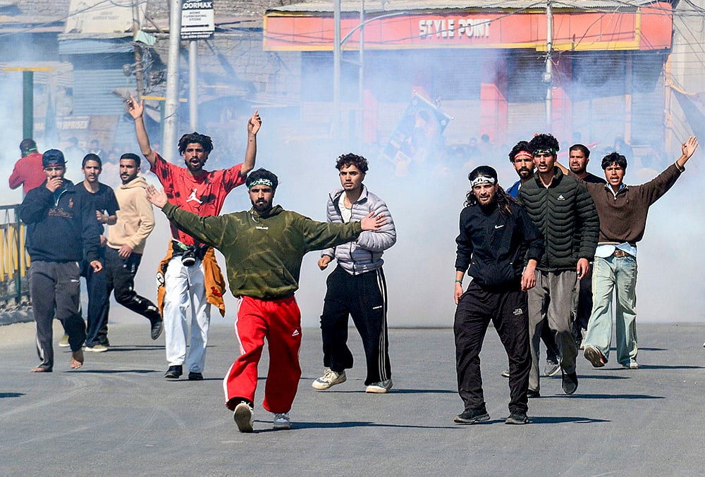 | Photo: PTI : People stage a protest against the alleged killing of Iran's Supreme Leader Ayatollah Ali Khamenei in a US-Israel strike, amid severe restrictions on the movement of people in parts of Kashmir, Srinagar.