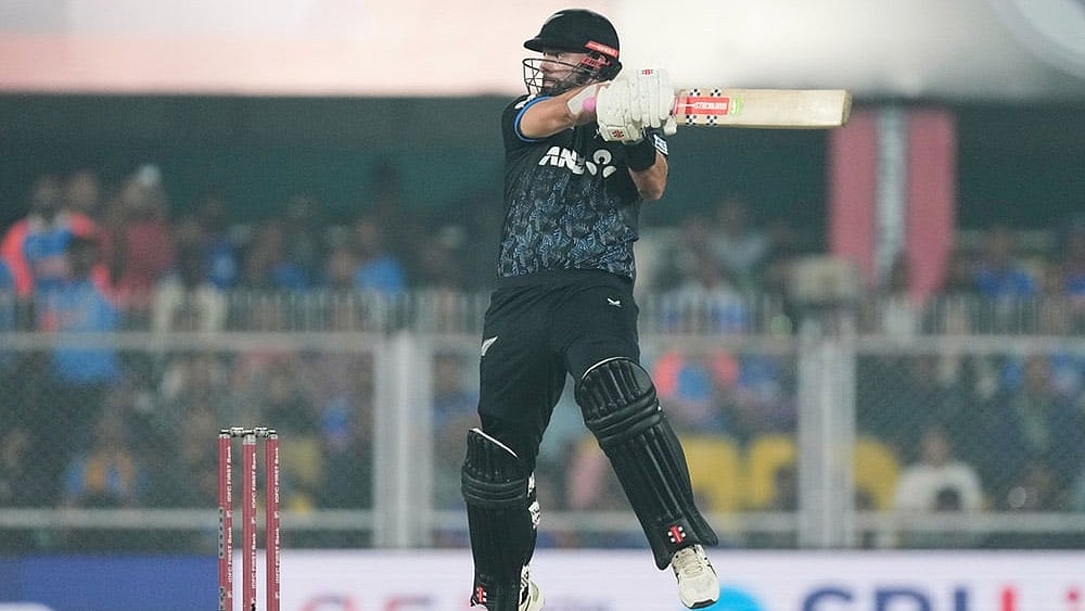 Photo: AP/Anupam Nath : New Zealand's Daryl Mitchell plays a shot during the third T20 cricket match between India and New Zealand in Guwahati, India.