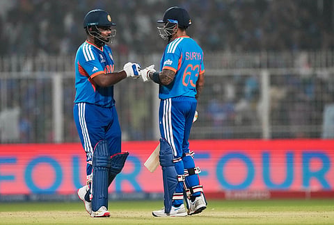 India's captain Suryakumar Yadav, right, and batting partner Sanju Samson touch gloves during the T20 World Cup cricket match between India and West Indies in Kolkata.