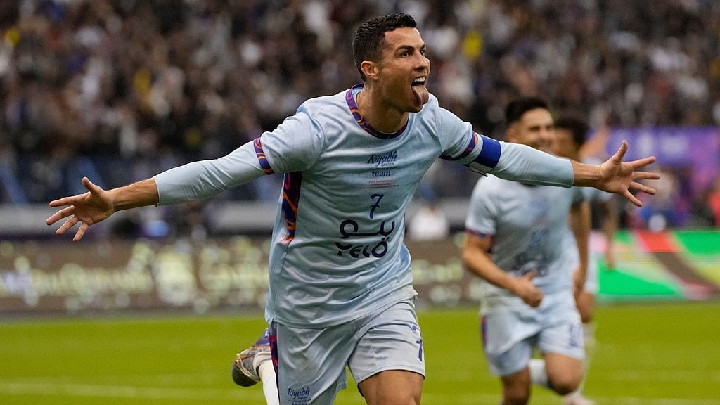 AP Photo/Hussein Malla : Al Nassr's Cristiano Ronaldo celebrates after scoring at the King Saud University Stadium, in Riyadh, Saudi Arabia, Jan. 19, 2023. 
