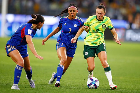 Australia's Caitlin Foord, right, and Philippines' Jael Guy compete for the ball during the Women's Asia Cup soccer match between Australia and the Philippines in Perth, Australia.