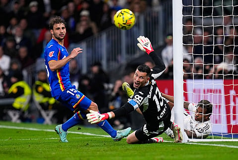 Getafe's goalkeeper David Soria fights for the ball during a Spanish La Liga soccer match between Real Madrid and Getafe in Madrid, Spain.