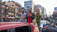 Photo: AP : Balendra Shah, center, former mayor of Kathmandu Metropolitan City and prime ministerial candidate of the Rastriya Swatantra Party, joins Rabi Lamichhane, left, the party's president, during an election campaign rally in Lalitpur, Nepal, Saturday, Feb. 28, 2026.