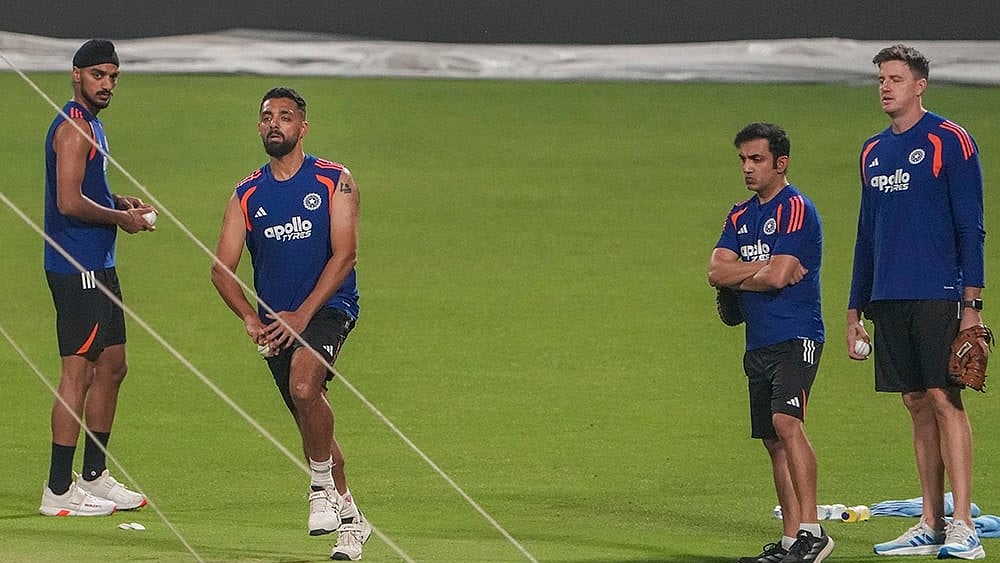 | Photo: PTI/Manvender Vashist Lav : From left, India's Arshdeep Singh, Varun Chakravarthy, head coach Gautam Gambhir and bowling coach Morne Morkel during a practice session ahead of an ICC Men's T20 World Cup 2026 cricket match between India and West Indies, at the Eden Gardens, in Kolkata, West Bengal.