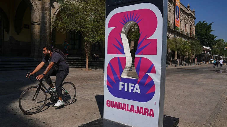 A cyclist rides past an installation promoting the FIFA World Cup 2026 in Guadalajara, Mexico. - | Photo: AP