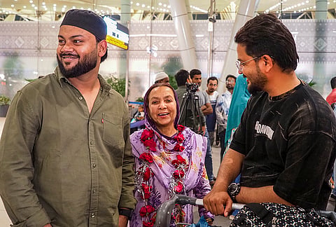 An Indian passenger being welcomed by family members upon her arrival on a flight from Saudi Arabia, amid the ongoing Iran-Israel conflict, at Sardar Vallabhbhai Patel International Airport, in Ahmedabad, Gujarat.