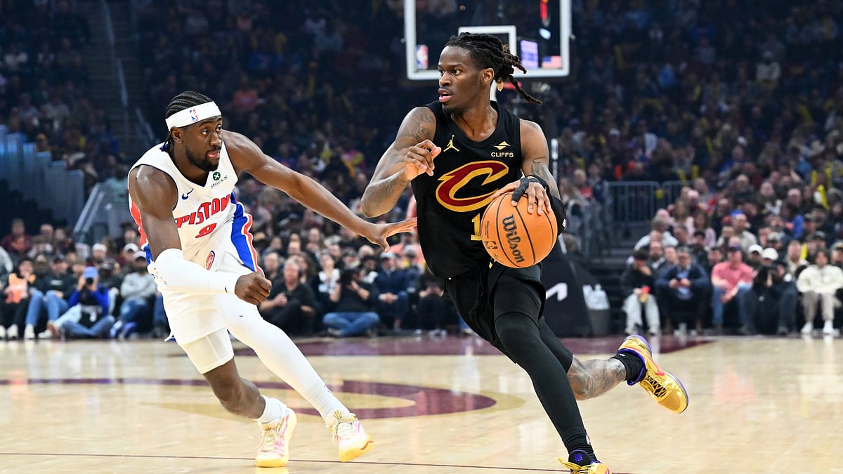 Keon Ellis #14 of the Cleveland Cavaliers brings the ball up court around Caris LeVert #8 of the Detroit Pistons d3q at Rocket Arena on March 03, 2026 in Cleveland, Ohio. The Cavaliers defeated the Pistons 113-109.