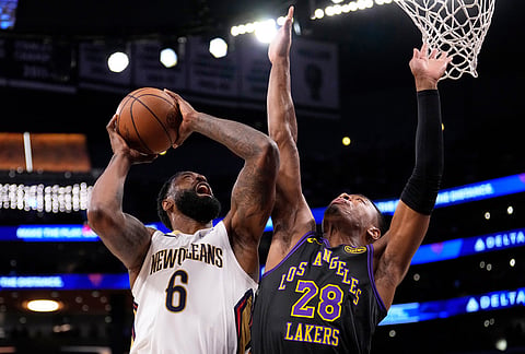New Orleans Pelicans center DeAndre Jordan, left, shoots as Los Angeles Lakers forward Rui Hachimura defends during the first half of an NBA basketball game in Los Angeles. 
