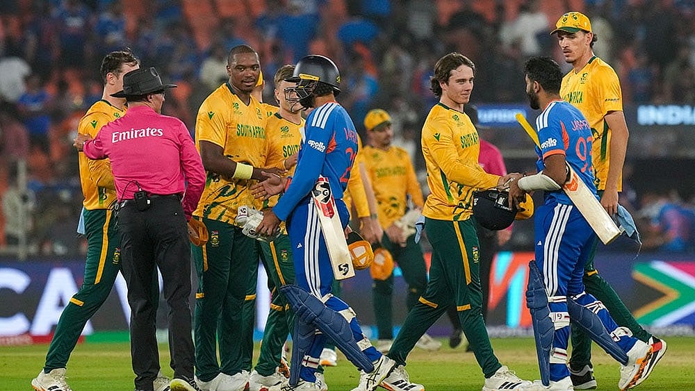 | Photo: PTI/Arun Sharma : South Africa's players being congratulated by India's Varun Chakravarthy and Jasprit Bumrah after winning the ICC Men's T20 World Cup 2026 cricket match between India and South Africa, at the Narendra Modi Stadium, in Ahmedabad.