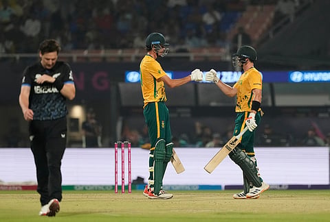 South Africa's Tristan Stubbs gives fist touch after hitting a six to batting partner Marco Jansen during the first T20 World Cup cricket semifinal match between New Zealand and South Africa in Kolkata.