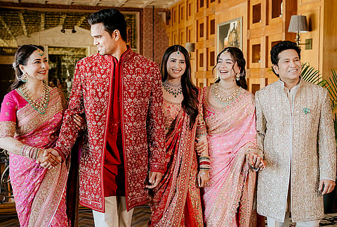 Cricketer Sachin Tendulkar, right, with wife Anjali Tendulkar, left, daughter Sara Tendulkar, second right, during his son's Arjun Tendulkar, second left, and industrialist Ravi Ghai’s granddaughter Saaniya Chandhok wedding ceremony, in Mumbai.
