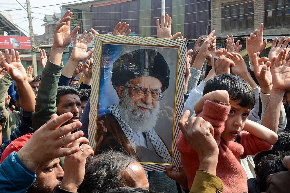 | Photo: PTI : People stage a protest against the killing of Iran's supreme leader Ayatollah Ali Khamenei in US-Israel joint strikes, in Srinagar. Partial restrictions on movement of people remained in force in Kashmir as a precautionary measure amid the protests.