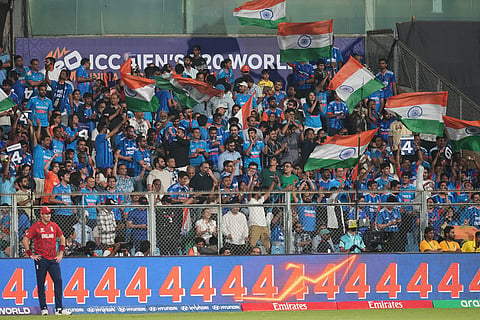 Indian supporters react during the T20 World Cup cricket semi-final match between India and England in Mumbai, India.