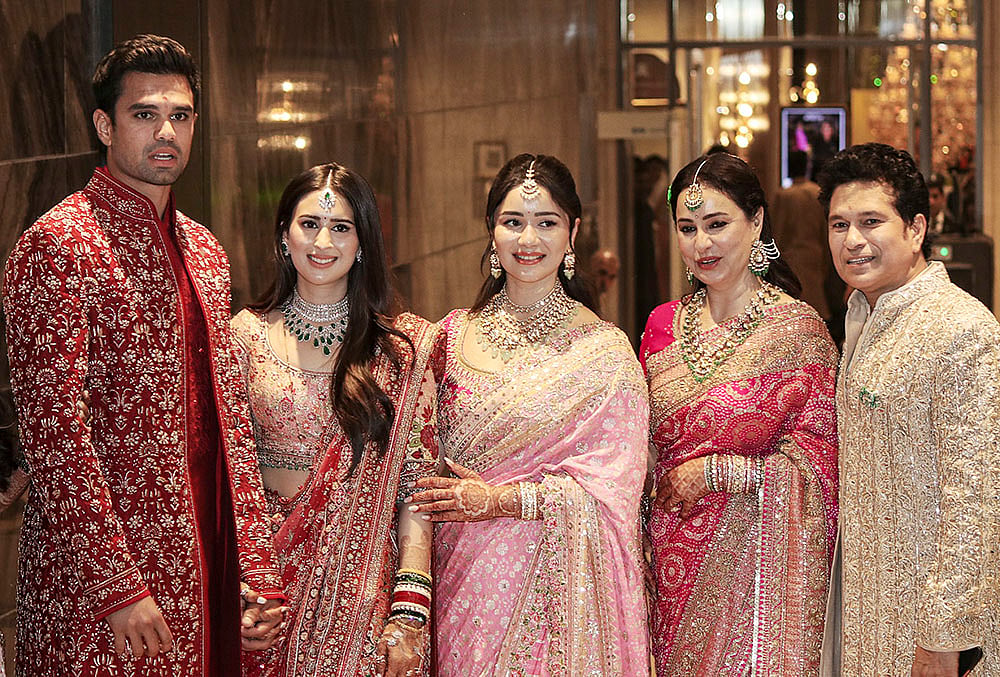 | Photo: PTI : From right, Cricketer Sachin Tendulkar, with wife Anjali Tendulkar, daughter Sara Tendulkar during his son's Arjun Tendulkar and industrialist Ravi Ghai’s granddaughter Saaniya Chandhok wedding ceremony, in Mumbai.