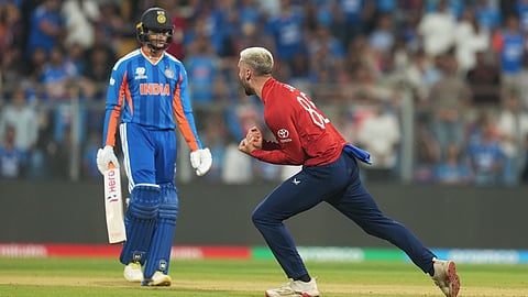 England's Will Jacks, right, celebrates the dismissal of India's Abhishek Sharma, left, during the T20 World Cup cricket semi-final match between India and England in Mumbai, India, Thursday, March 5, 2026.