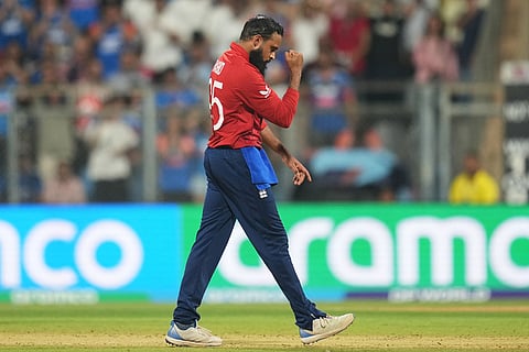 England's Adil Rashid celebrates the dismissal of India's Ishan Kishan during the T20 World Cup cricket semi-final match between India and England in Mumbai, India.