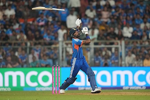 India's Hardik Pandya loses his grip on the bat during the T20 World Cup cricket semi-final match between India and England in Mumbai, India.