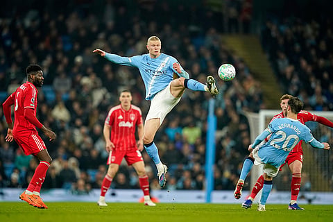 Manchester City's Erling Haaland controls the ball during the English Premier League soccer match between Manchester City and Nottingham Forest in Manchester, England.
