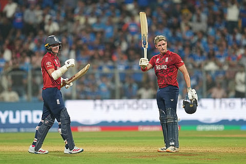 England's Jacob Bethell, right, celebrates after scoring a century during the T20 World Cup cricket semi-final match between India and England in Mumbai, India.