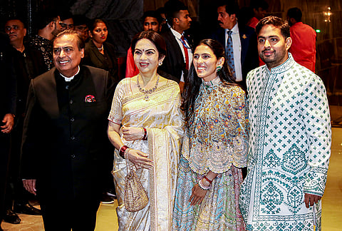 Reliance Industries Chairman Mukesh Ambani, left, with his wife Nita Ambani, second left, and family members during the wedding ceremony of cricketer Sachin Tendulkar’s son Arjun Tendulkar and industrialist Ravi Ghai’s granddaughter Saaniya Chandhok, in Mumbai.