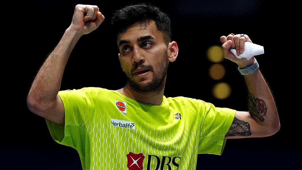 Bradley Collyer/PA via AP : India's Lakshya Sen celebrates winning his men's singles match against China's Shi Yuqi on day one of the All England Open Badminton Championships in Birmingham.