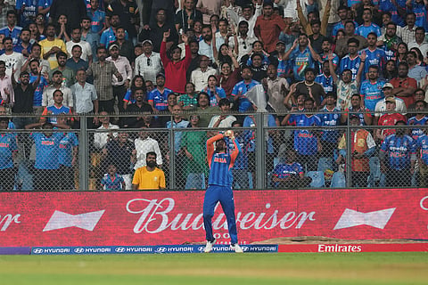 India's Tilak Varma takes the catch to dismiss England's Sam Curran during the T20 World Cup cricket semi-final match between India and England in Mumbai, India.