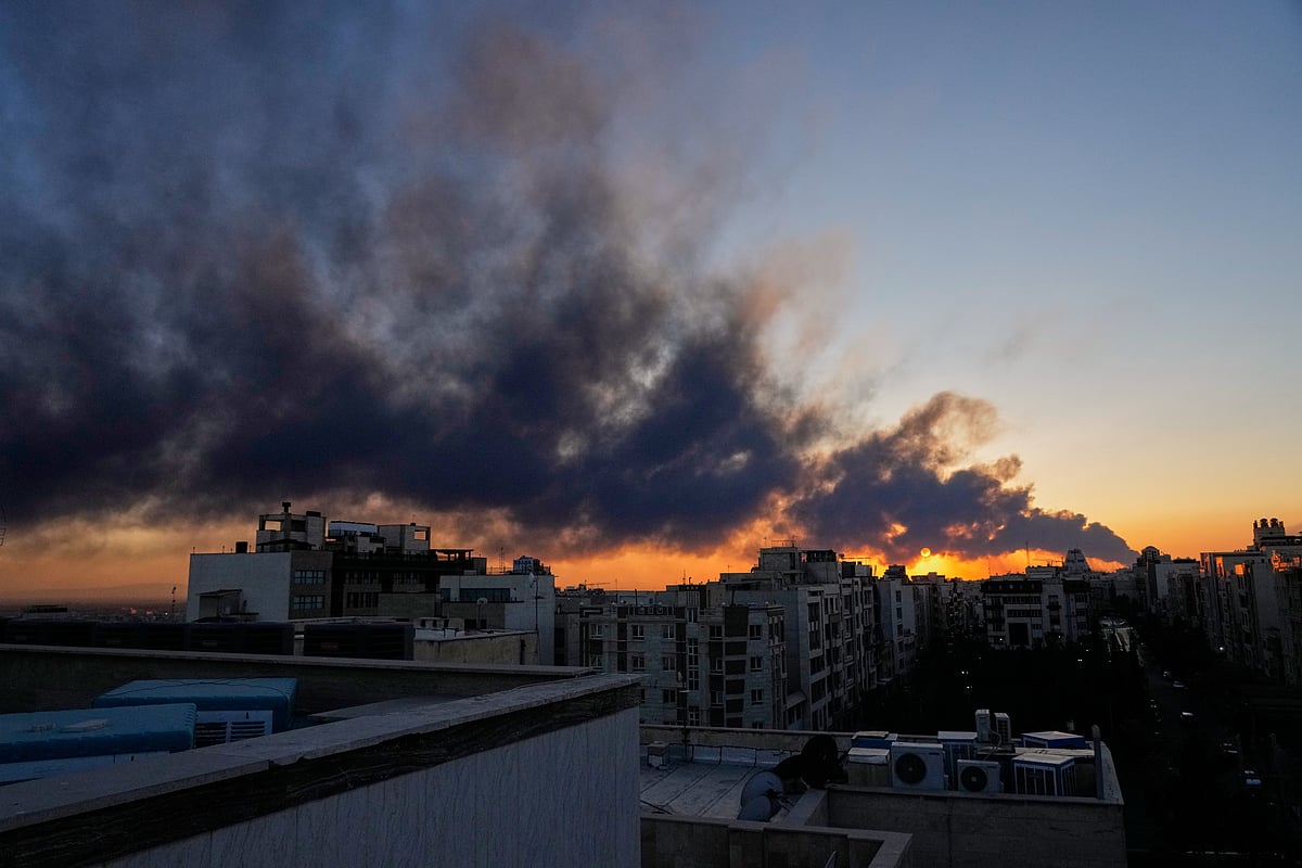 Representational Image: The sun sets behind a plume of smoke rising after a U.S.–Israeli military strike in Tehran, Iran, Tuesday, March 3, 2026. - AP News 