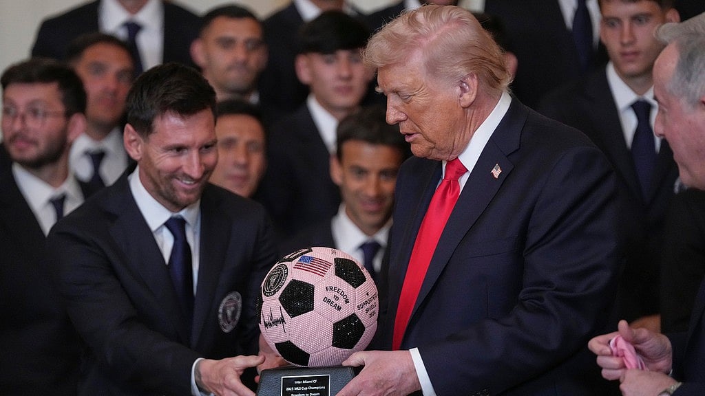 AP/Julia Demaree Nikhinson : President Donald Trump receives a soccer ball trophy from Lionel Messi during an event to honor the 2025 Major League Soccer champions Inter Miami in the East Room of the White House, Thursday, March 5, 2026, in Washington.