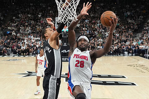 Detroit Pistons forward Isaiah Stewart (28) drives to the basket against San Antonio Spurs forward Victor Wembanyama (1) during the first half of an NBA basketball game in San Antonio.