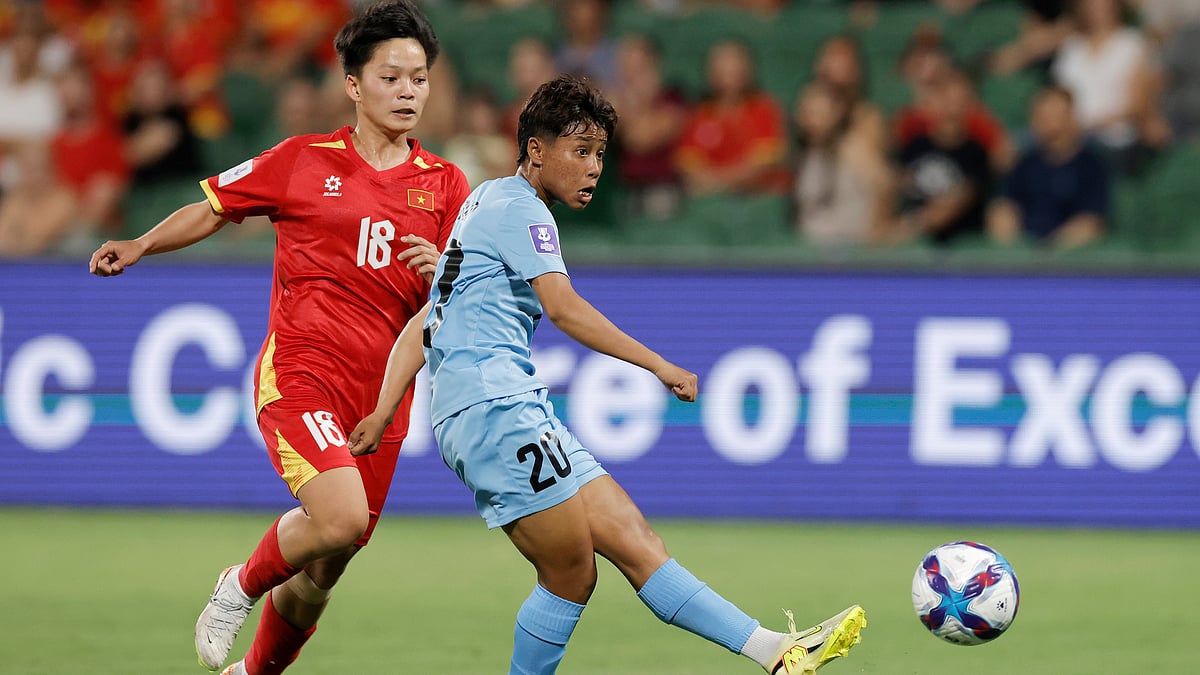 | Photo: AP/RICHARD WAINWRIGHT : India's Sanfida Nongrum, right, scores her team's first goal as Vietnam's Cù Thị Huỳnh Như looks on during the Women's Asia Cup soccer match between India and Vietnam in Perth, Australia, Wednesday, March 4, 2026. 