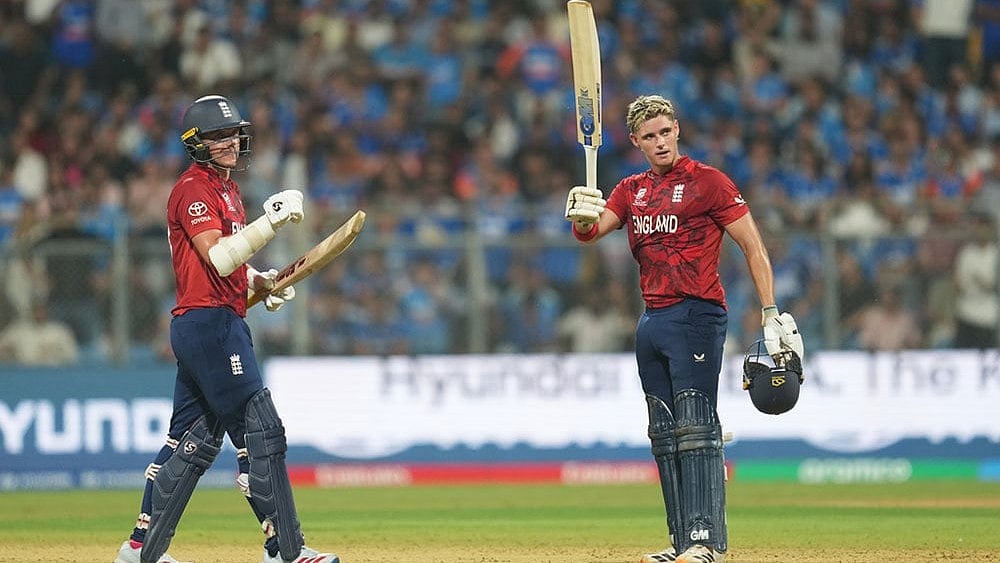 | Photo: AP/Rafiq Maqbool : England's Jacob Bethell, right, celebrates after scoring a century during the T20 World Cup cricket semi-final match between India and England in Mumbai, India.