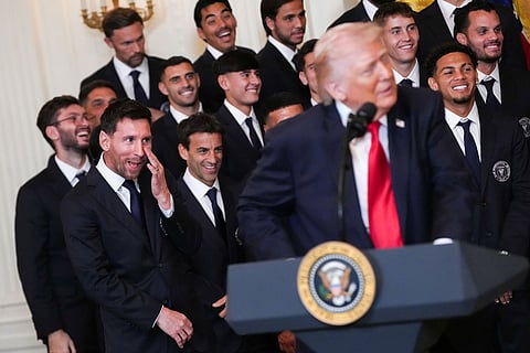Lionel Messi and teammates laugh as President Donald Trump speaks during an event to honor the 2025 Major League Soccer champions Inter Miami in the East Room of the White House in Washington.