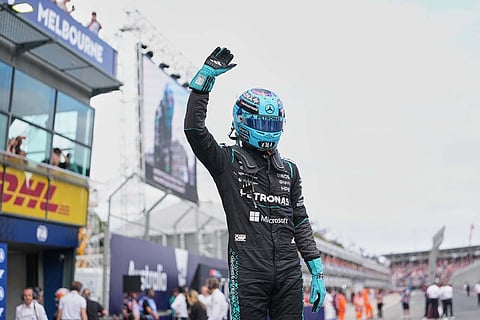 Mercedes driver George Russell of Britain reacts after winning the qualifying session for the Australian Formula One Grand Prix at Albert Park, in Melbourne, Australia,.