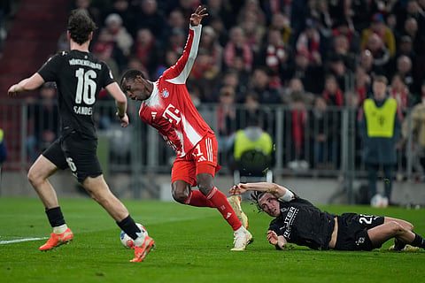 Bayern's Nicolas Jackson is fouled by Moenchengladbach's Rocco Reitz during the Bundesliga soccer match between FC Bayern Munich and Borussia Moenchengladbach in Munich, Germany.