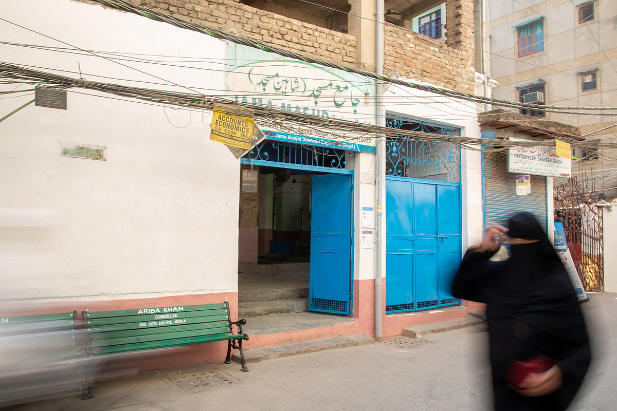  A woman crosses the Shaheen Masjid in Jasola Vihar. 